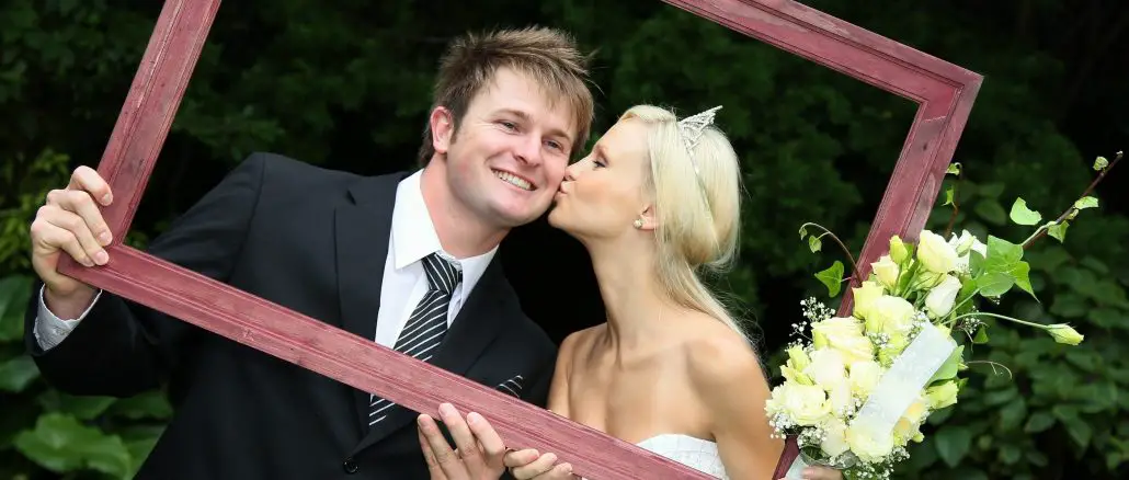 bride and groom in a wooden frame bride and groom in a wooden frame