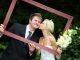 bride and groom in a wooden frame